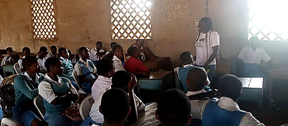 Students in a classroom listening to a facilitator during a TOAK Foundation training session
